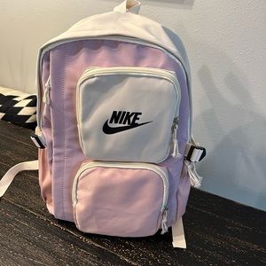 Pink purple and white Nike backpack